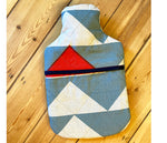 Load image into Gallery viewer, Quilted Piecework; blue and red hot water bottle.
