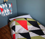 Load image into Gallery viewer, Pennon: Churlish Green, Red and Slate Quilted Bedspread
